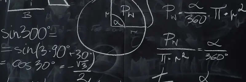 Handwritten equations covering a chalkboard