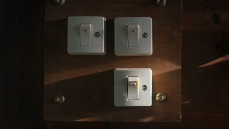 A single wall light switch photographed close up