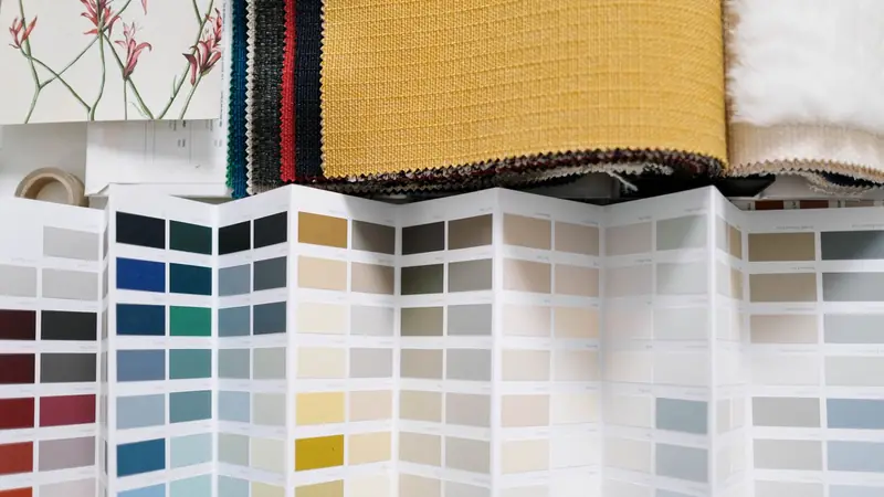 Fabric swatches in graded colours laid out side by side