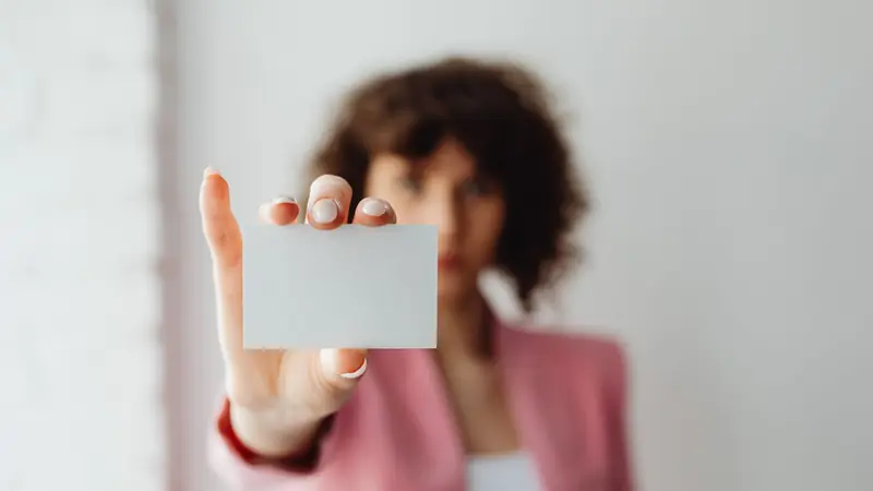 A stack of printed business cards on a desk