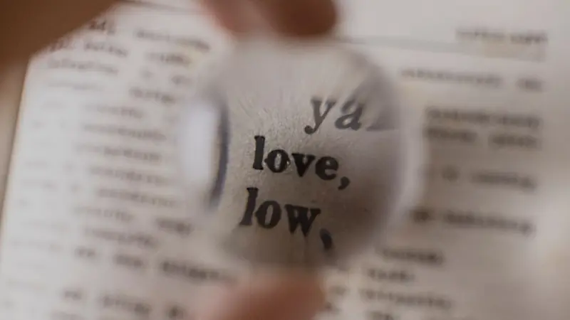 A magnifying glass over printed text