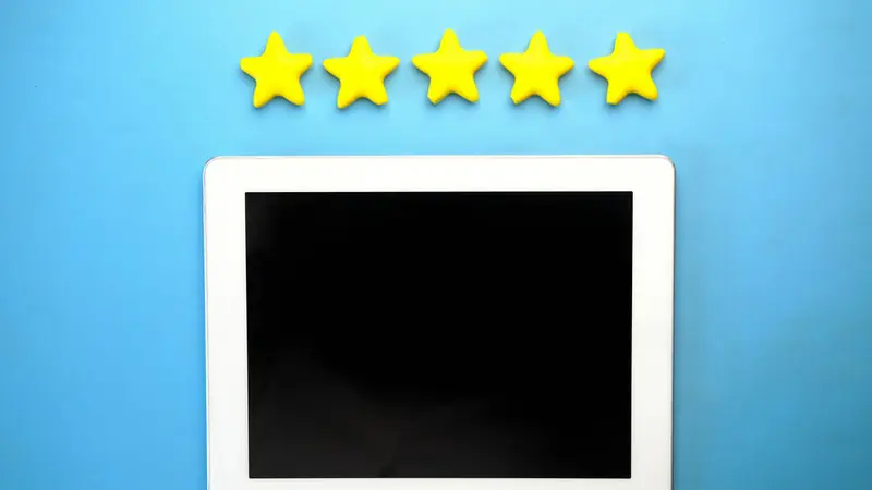 Five printed stars on a review card