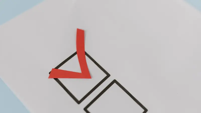 A clipboard checklist being ticked off