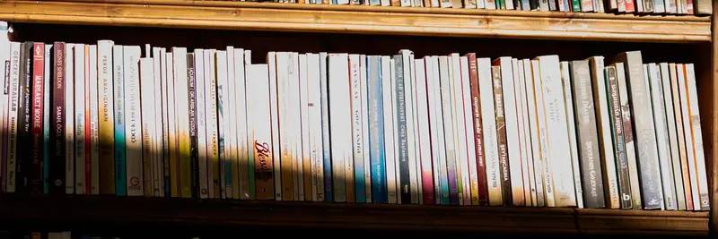 Tall bookshelves filled with reference volumes