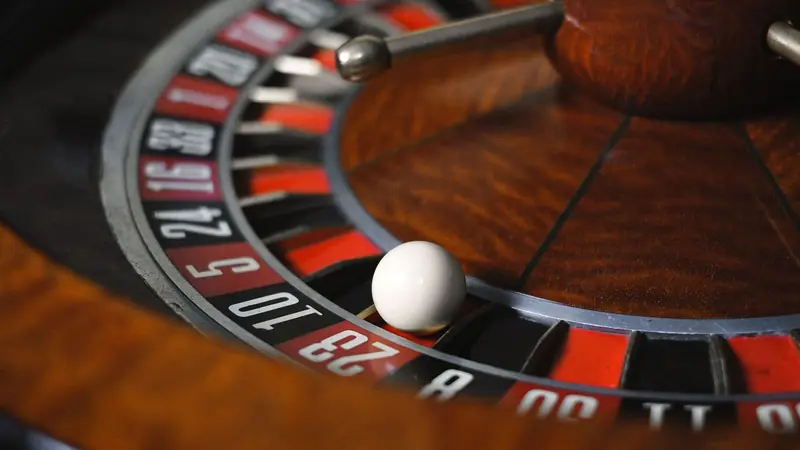 A roulette wheel spinning in a casino