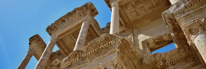 Weathered stone columns of a classical Roman building